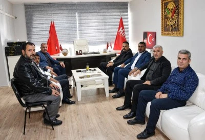 Umre d&ouml;n&uuml;ş&uuml; MHP'den Uncuoğlu'na ziyaret